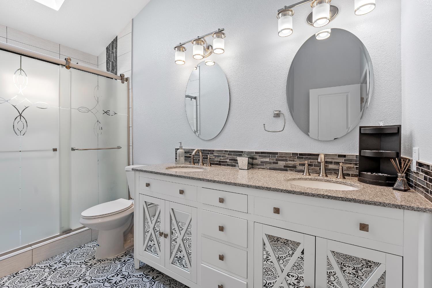 8170 Grizzly Flat Road Somerset, CA 95684 - Photo 28 of 43 a bathroom with a double vanity sink mirror and toilet