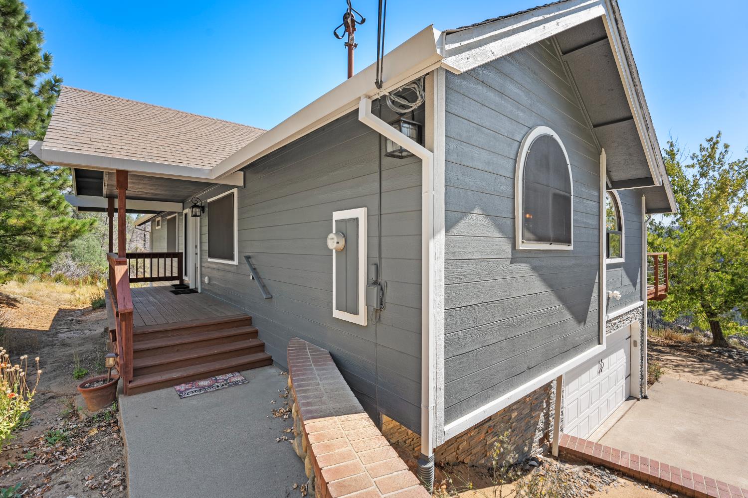 8170 Grizzly Flat Road Somerset, CA 95684 - Photo 3 of 43 a view of a porch with wooden floor and stairs