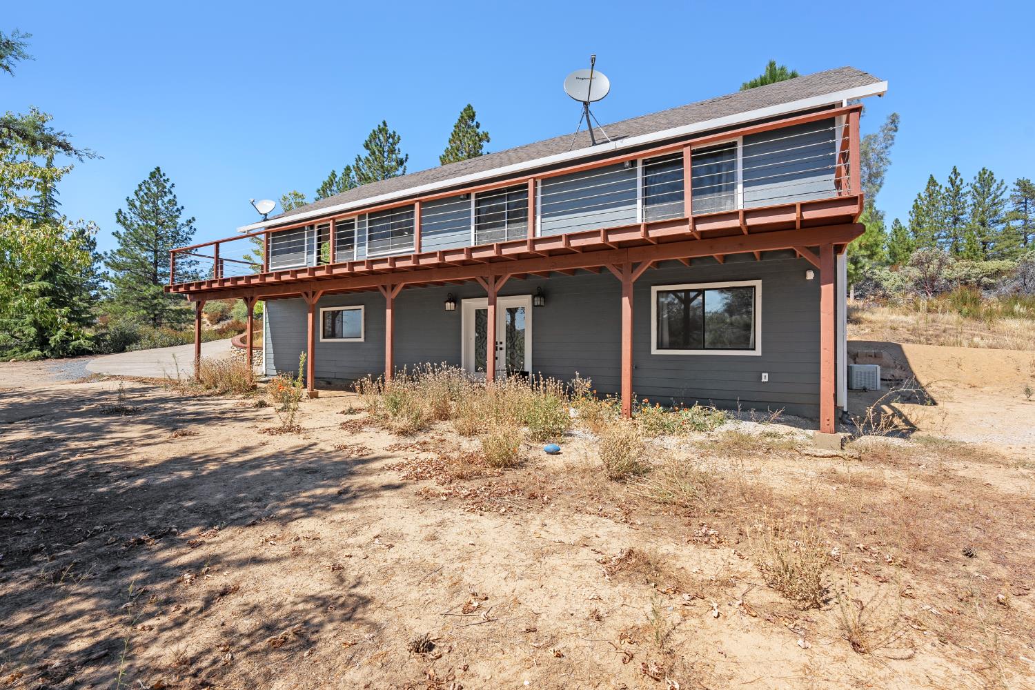 8170 Grizzly Flat Road Somerset, CA 95684 - Photo 37 of 43 a front view of a house with a yard
