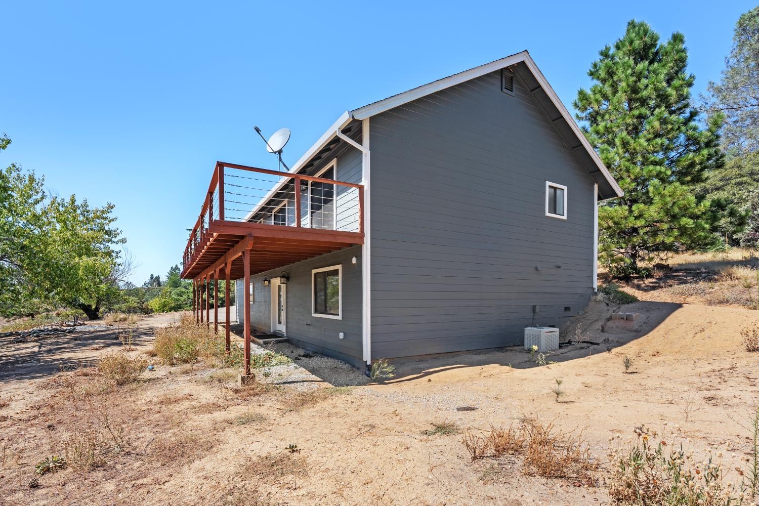 8170 Grizzly Flat Road Somerset, CA 95684 - Photo 38 of 43 a front view of a house with a yard