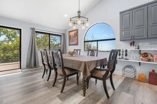 a view of a dining room with furniture window and outside view