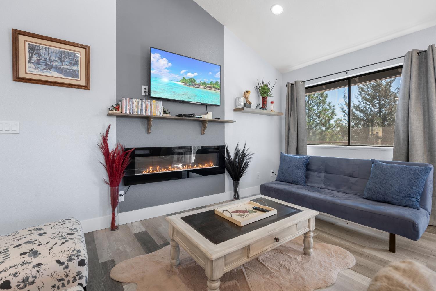8170 Grizzly Flat Road Somerset, CA 95684 - Photo 9 of 43 a living room with furniture and a flat screen tv