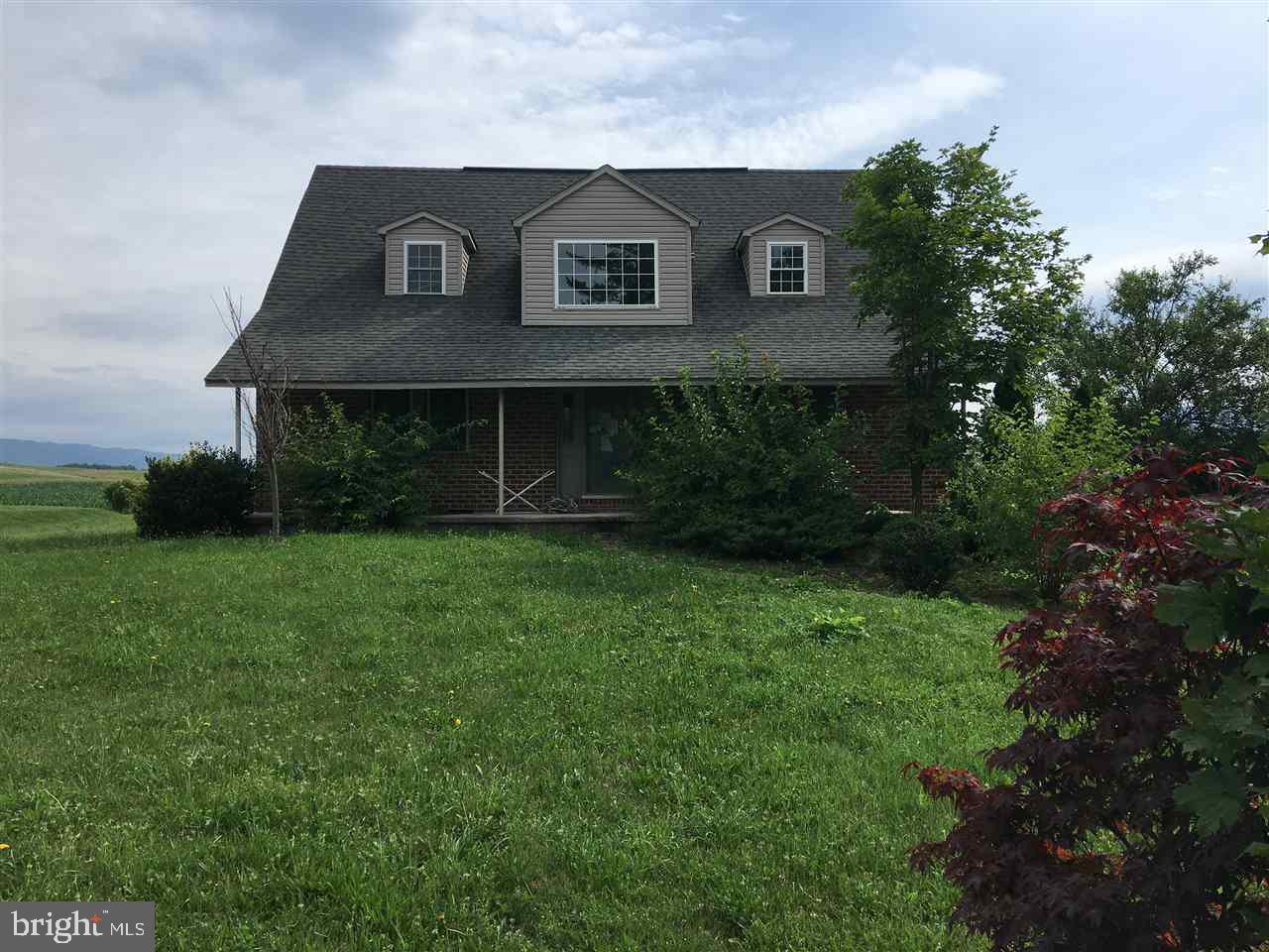 18733 West Dry Run Road Dry Run, PA 17220 - Photo 1 of 1 a front view of a house with a garden