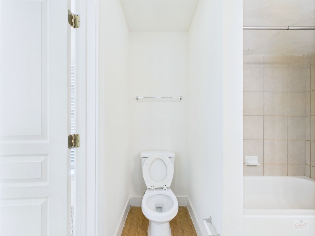 711 West 32nd Street, Unit 151 Austin, TX 78705 - Photo 11 of 21 a bathroom with a toilet and a shower