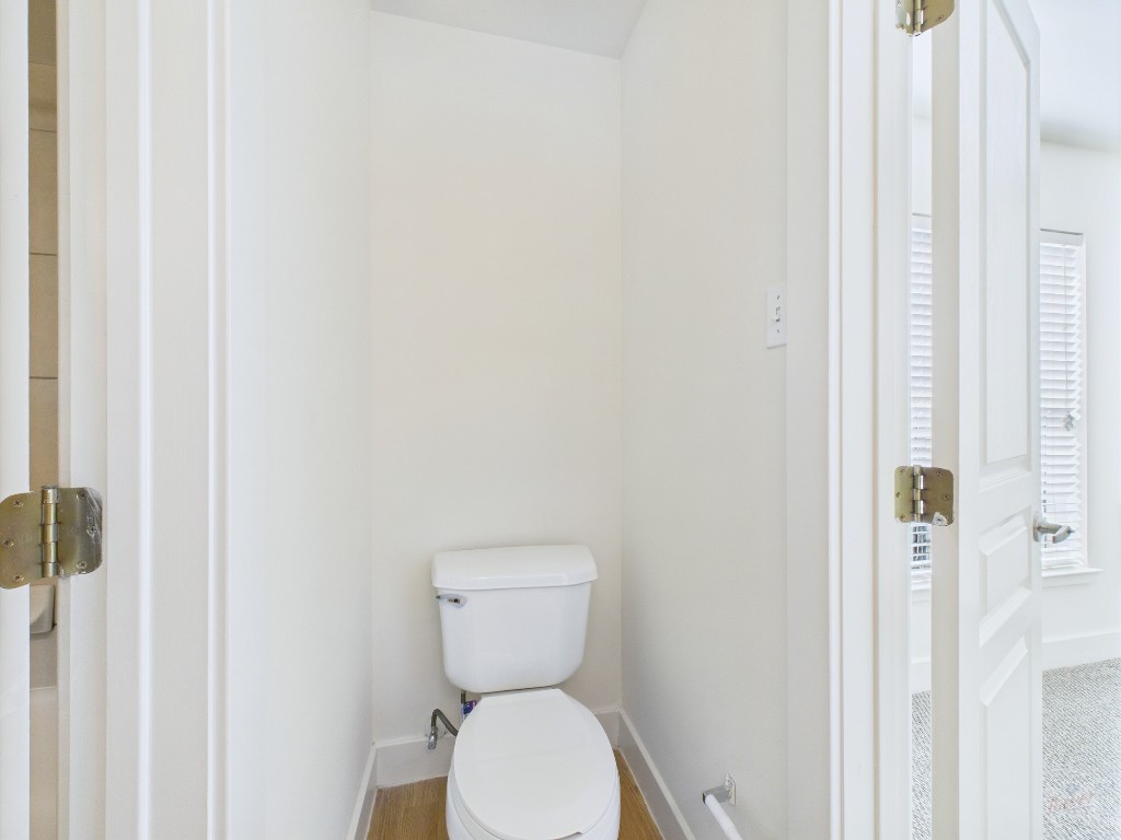 711 West 32nd Street, Unit 151 Austin, TX 78705 - Photo 14 of 21 a white toilet sitting next to a shower