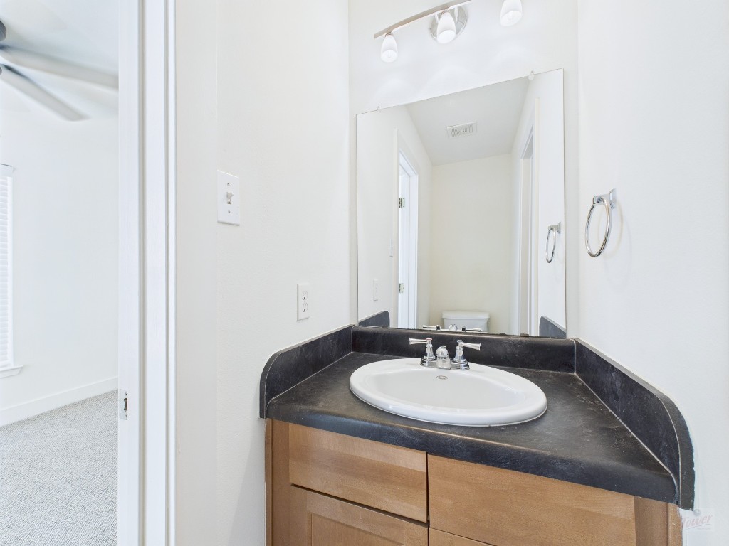 711 West 32nd Street, Unit 151 Austin, TX 78705 - Photo 15 of 21 a bathroom with a sink and a mirror