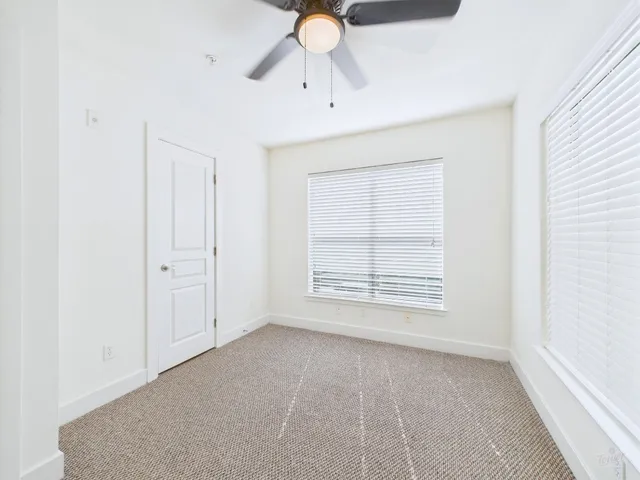 a view of a hallway with closet