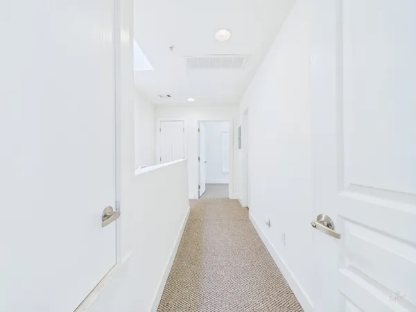 a view of a hallway with closet