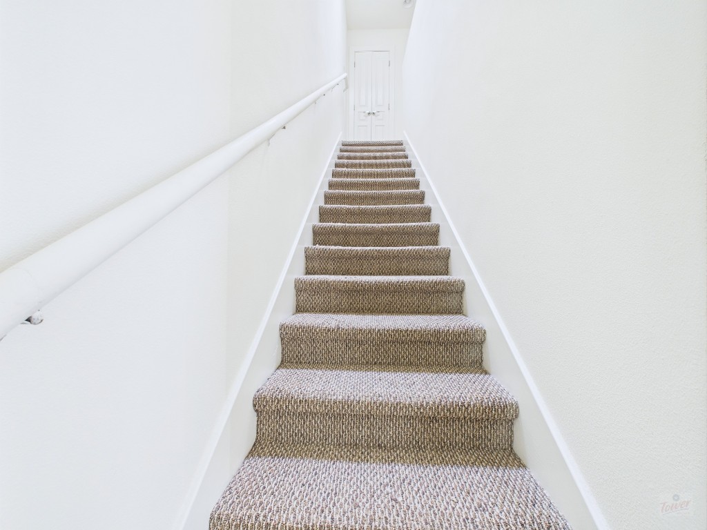 711 West 32nd Street, Unit 151 Austin, TX 78705 - Photo 7 of 21 a view of staircase with white walls