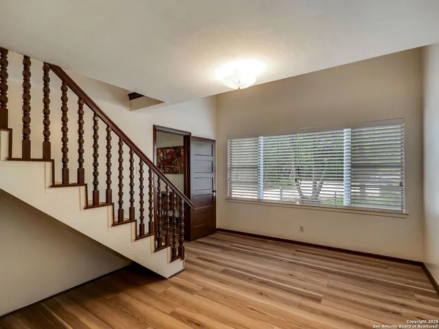 a bathroom with a sink mirror and toilet