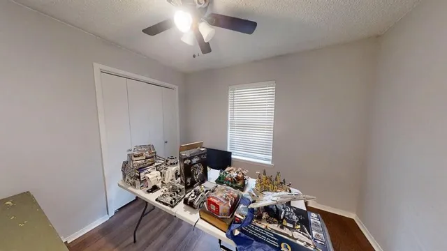 a bed room with furniture and wooden floor