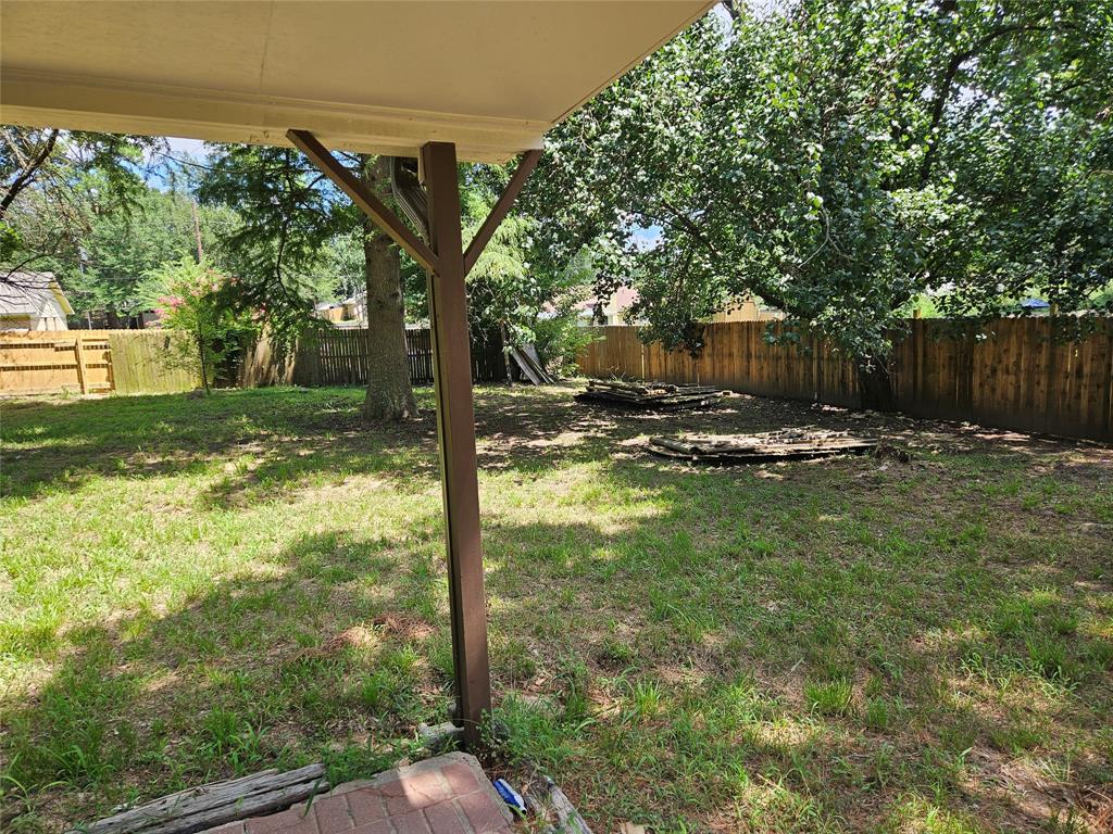 16455 Red Fern Road Flint, TX 75762 - Photo 24 of 25 a view of a large yard with large trees and wooden fence