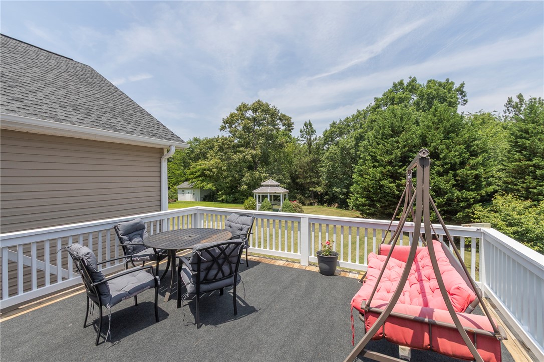 861 North Old Pendleton Road Liberty, SC 29657 - Photo 33 of 45 An inviting deck overlooks a lush yard, offering ample space for outdoor enjoyment and relaxation.