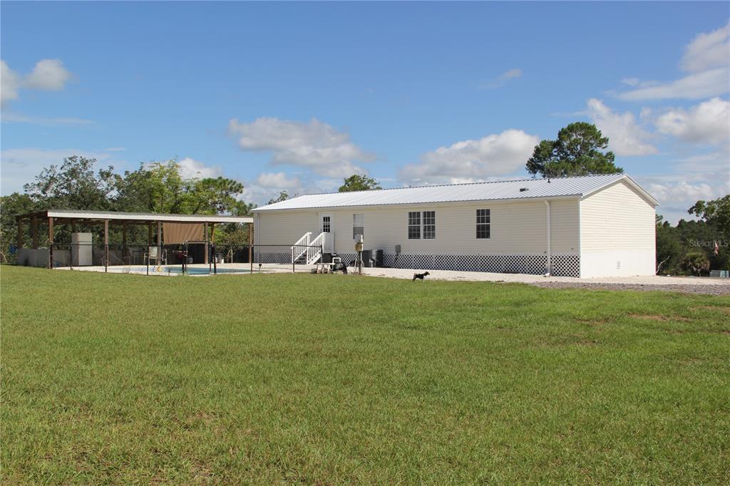 13127 Star Road Brooksville, FL 34613 - Photo 3 of 54 a view of outdoor space yard and deck