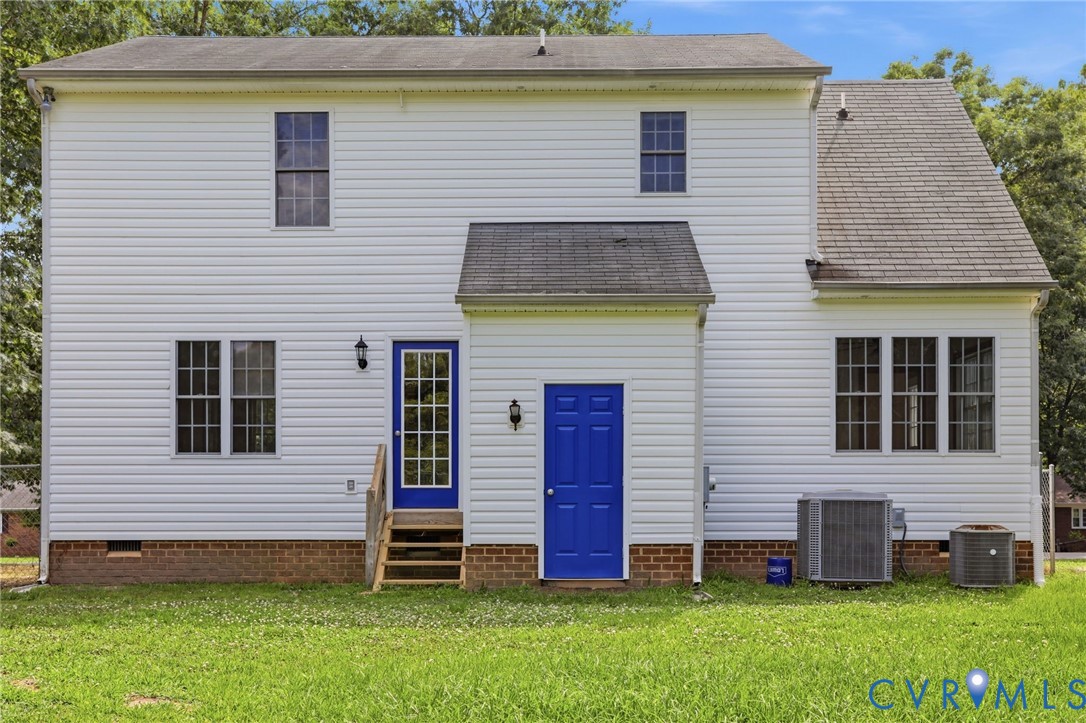 14420 Branding Iron Road Chesterfield, VA 23838 - Photo 39 of 50 White vinyl siding exterior with two blue doors, o