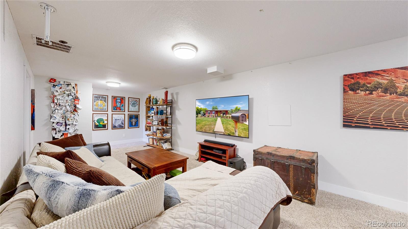 1741 West 55th Place Denver, CO 80221 - Photo 19 of 36 a living room with furniture and a flat screen tv