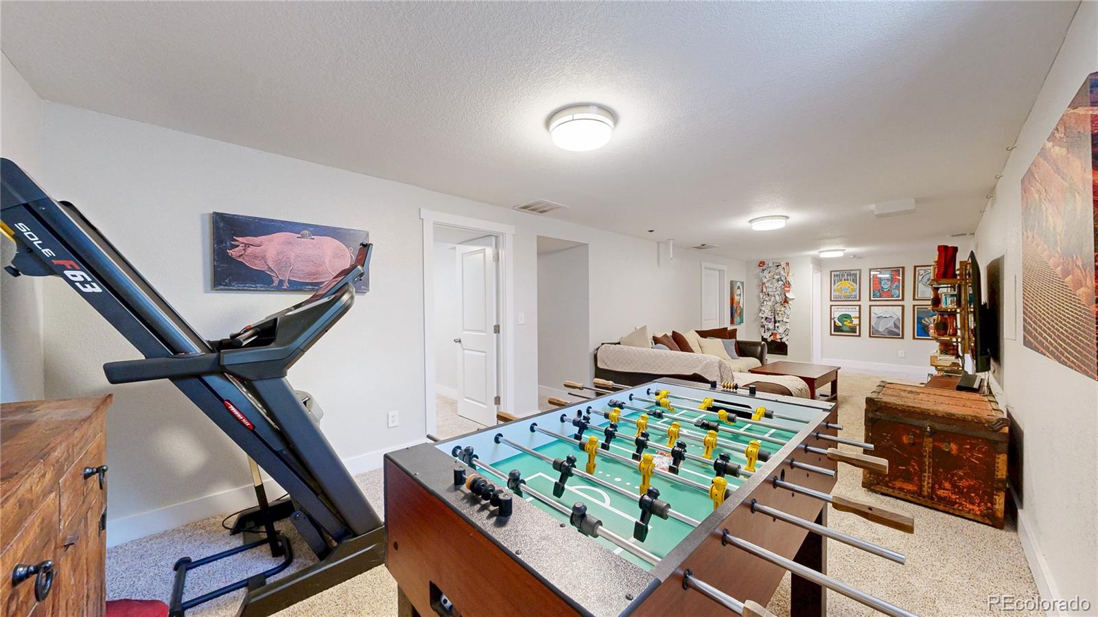 1741 West 55th Place Denver, CO 80221 - Photo 21 of 36 a bedroom with furniture and a mirror