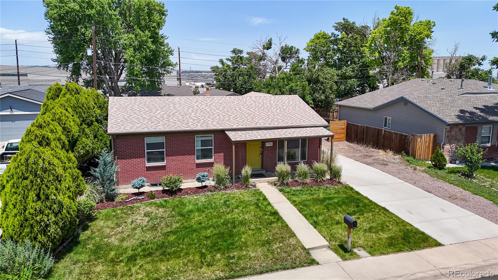 1741 West 55th Place Denver, CO 80221 - Photo 30 of 36 a aerial view of a house with yard and green space
