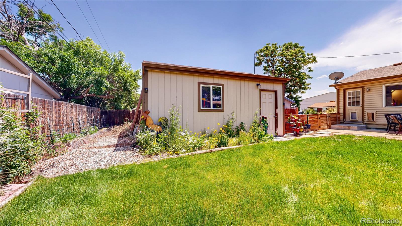 1741 West 55th Place Denver, CO 80221 - Photo 31 of 36 a house view with a garden space