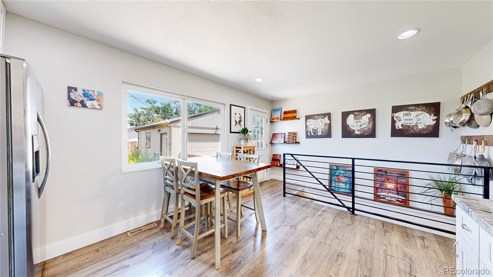 1741 West 55th Place Denver, CO 80221 - Photo 7 of 36 a view of a dining room with furniture window and wooden floor
