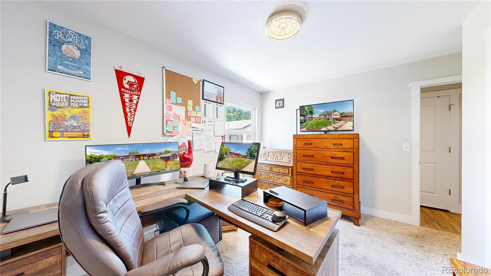 1741 West 55th Place Denver, CO 80221 - Photo 10 of 36 a bedroom with furniture and a window