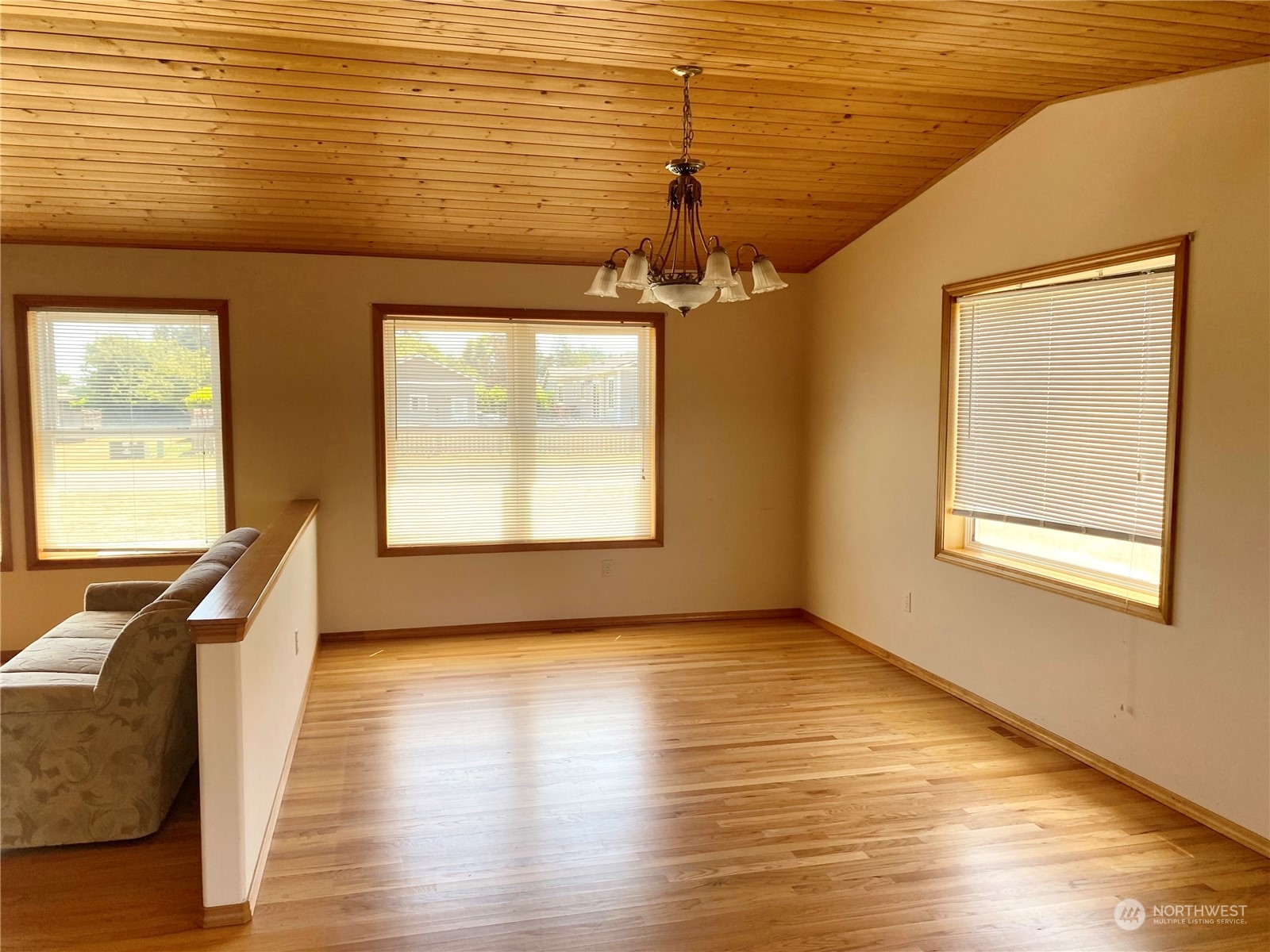 130 Cline Road Sequim, WA 98382 - Photo 12 of 35 a view of an empty room with wooden floor and a window