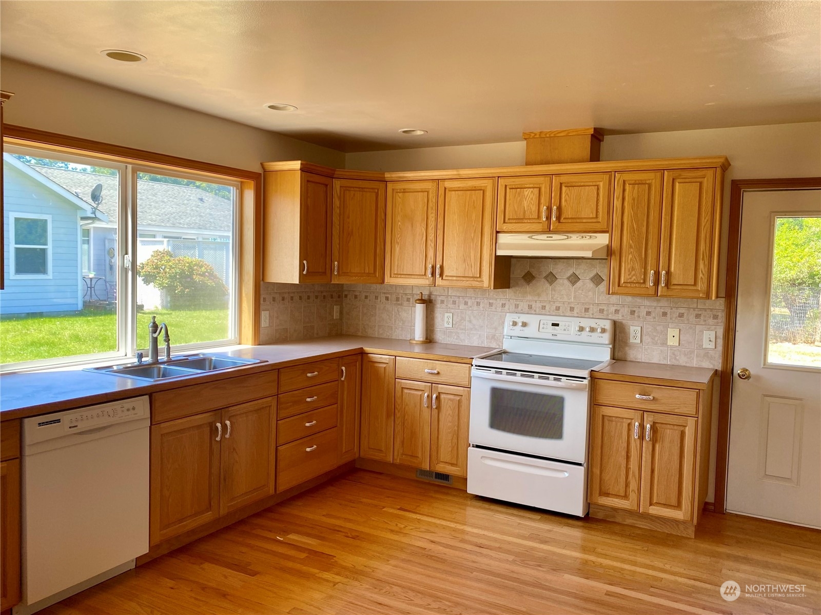 130 Cline Road Sequim, WA 98382 - Photo 13 of 35 a kitchen with a stove a sink and a window