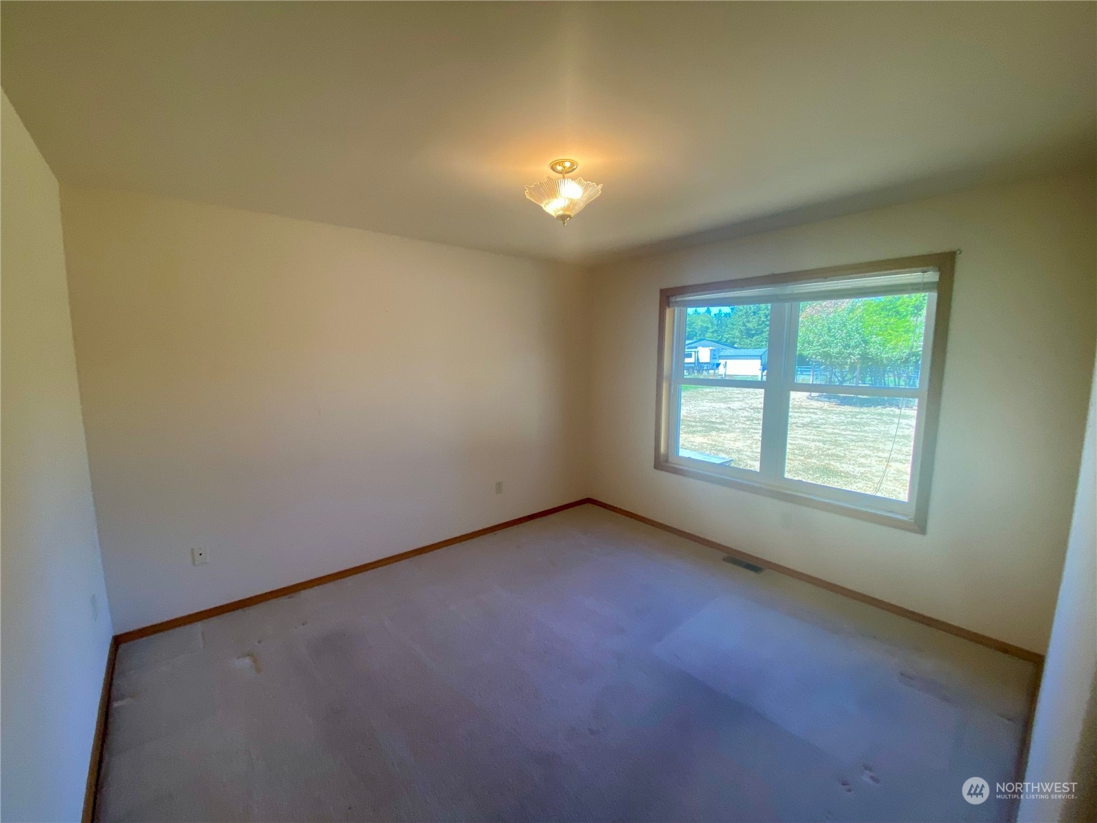 130 Cline Road Sequim, WA 98382 - Photo 20 of 35 an empty room with a empty space and windows