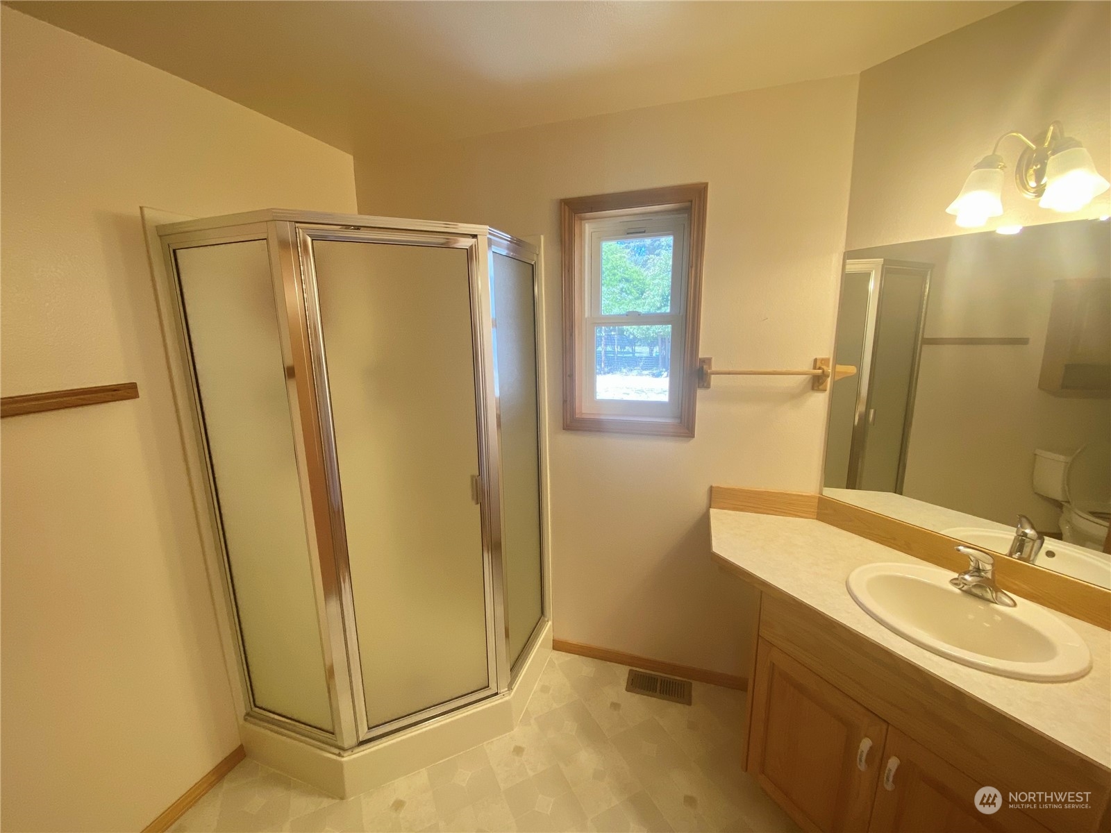 130 Cline Road Sequim, WA 98382 - Photo 22 of 35 a bathroom with a sink a mirror and a shower