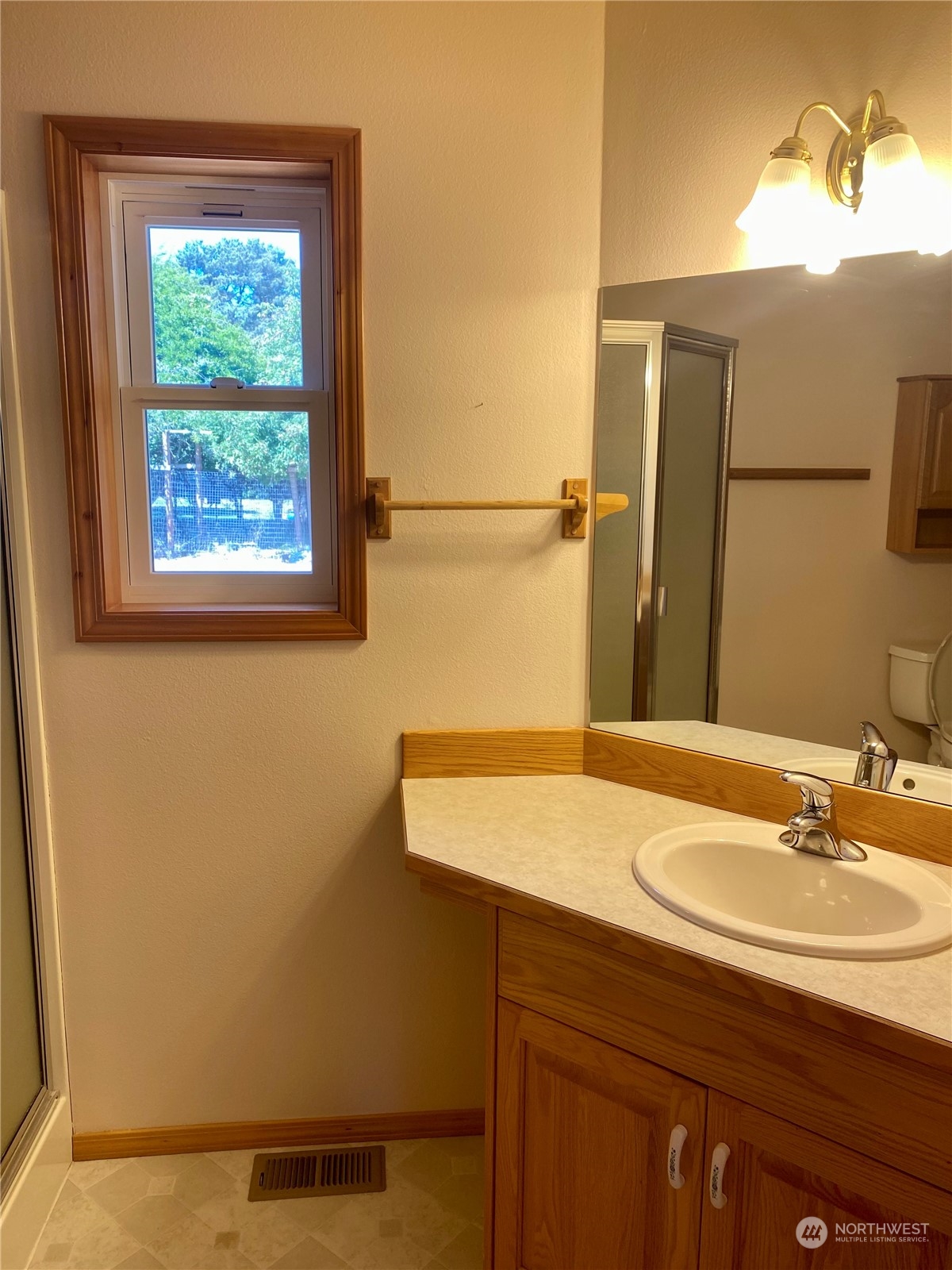 130 Cline Road Sequim, WA 98382 - Photo 23 of 35 a bathroom with a sink and a mirror