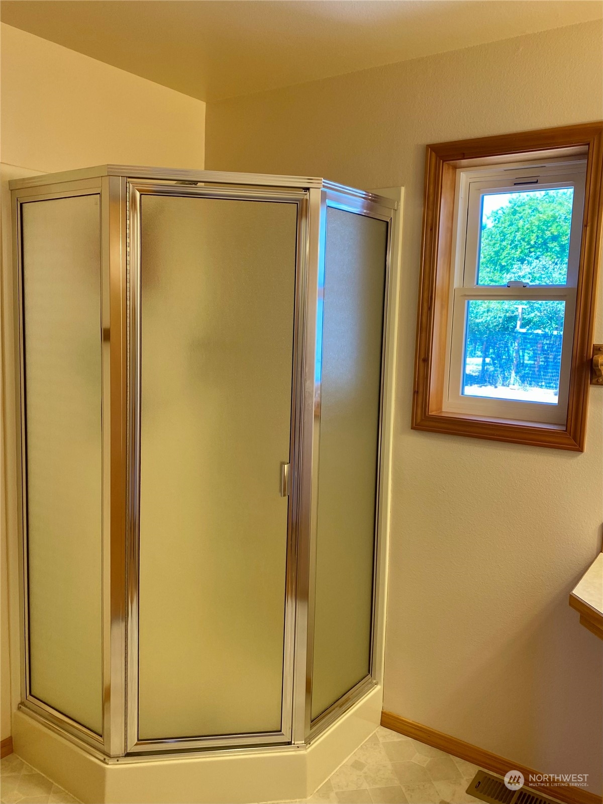 130 Cline Road Sequim, WA 98382 - Photo 24 of 35 a bathroom with a glass door shower