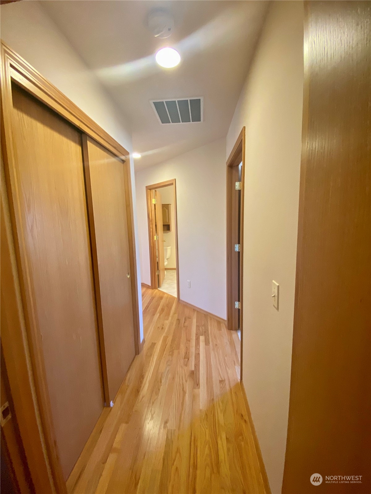 130 Cline Road Sequim, WA 98382 - Photo 26 of 35 a view of a hallway with wooden floor