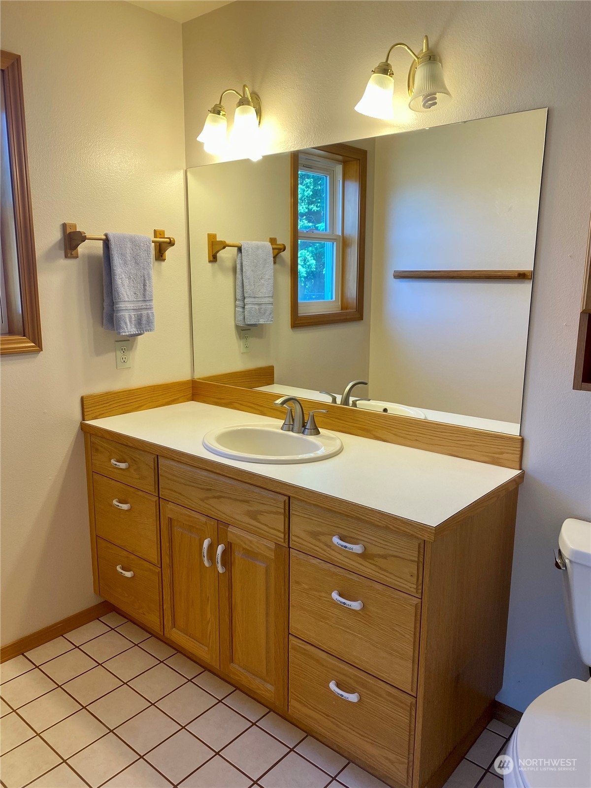130 Cline Road Sequim, WA 98382 - Photo 30 of 35 a bathroom with a sink vanity and mirror