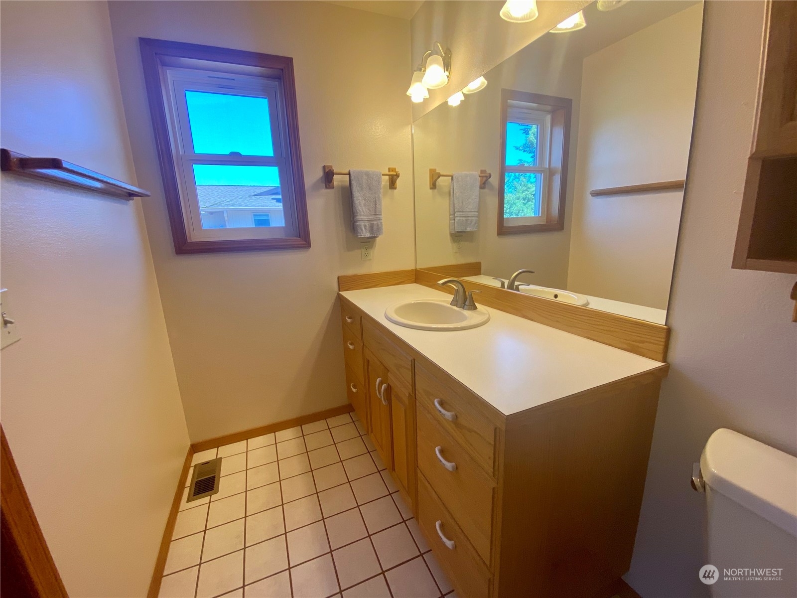130 Cline Road Sequim, WA 98382 - Photo 32 of 35 a bathroom with a sink a vanity and a mirror