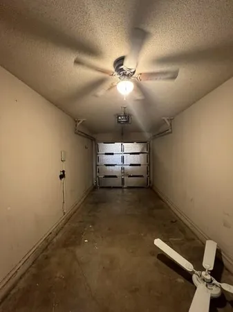 a view of a ceiling fan and window