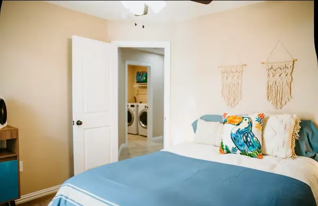 a bedroom with a bed and a table