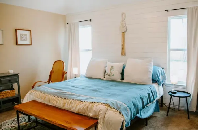 a bedroom with a bed and a table in it