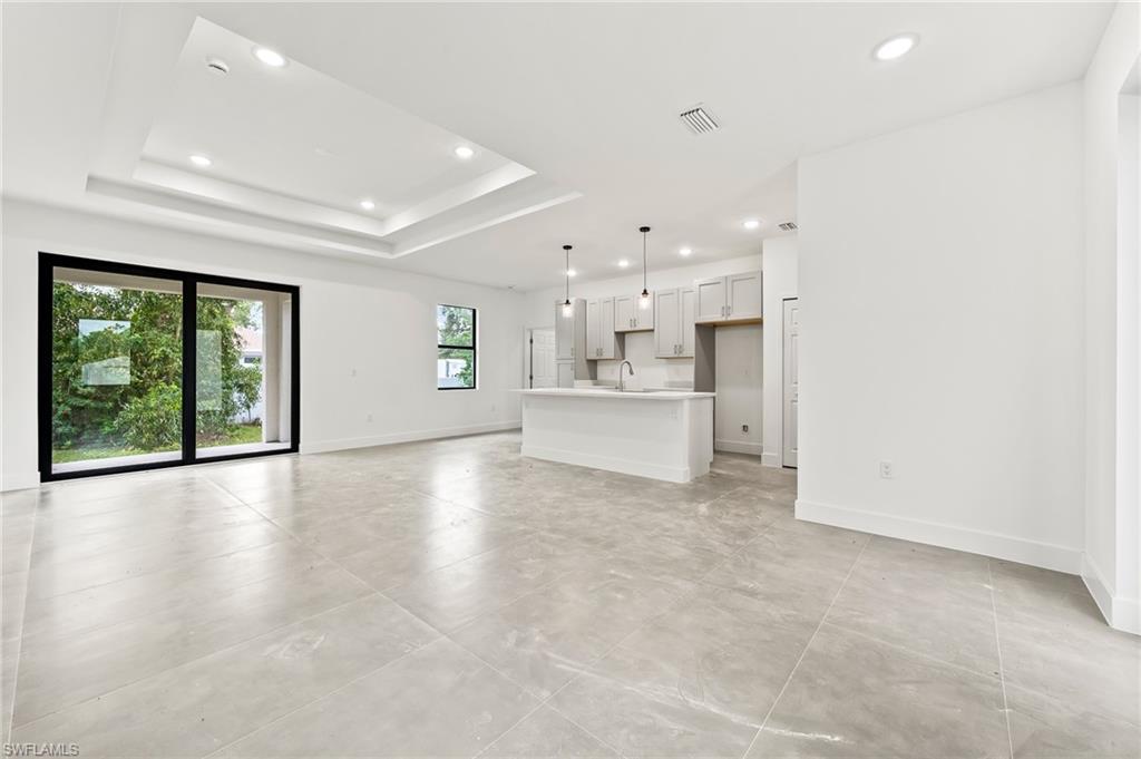 3705 37th Street Southwest Lehigh Acres, FL 33976 - Photo 5 of 35 a view of an empty room with a kitchen stove back oven