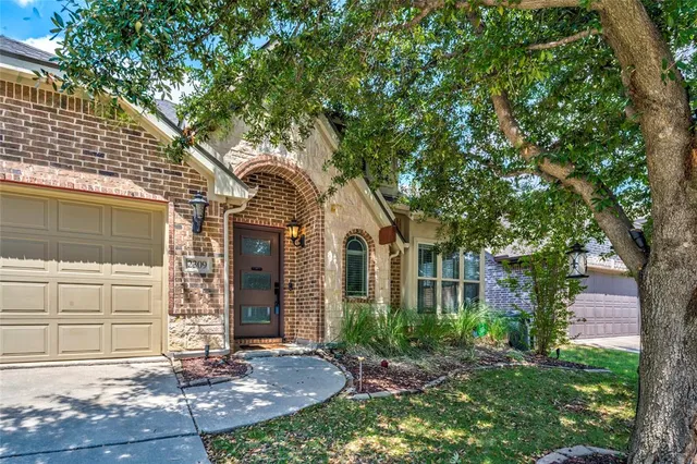 a front view of a house with yard
