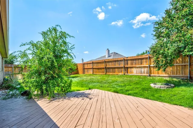 a view of backyard with green space