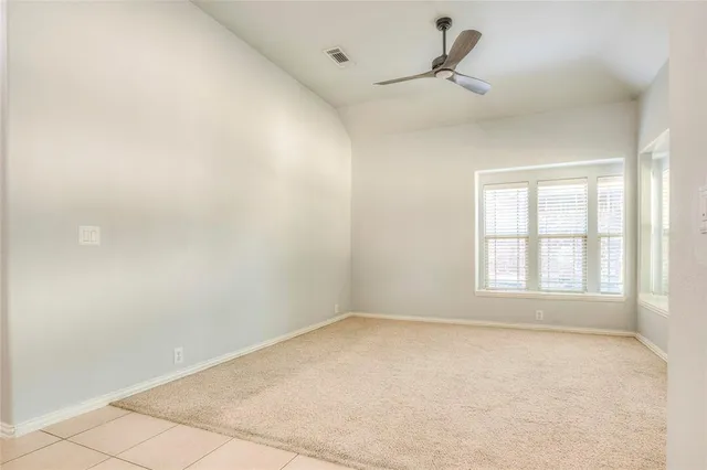 an empty room with a empty space and windows