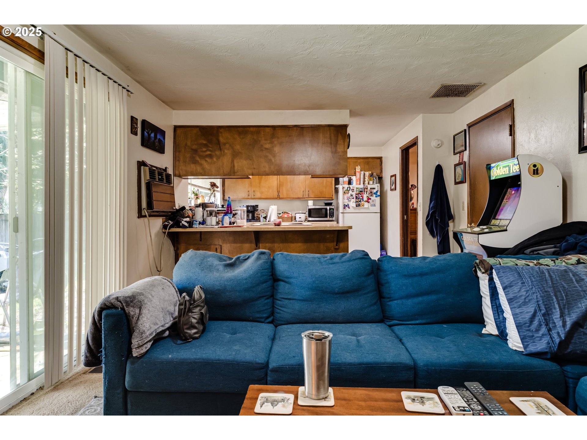 3911 Pam Street Eugene, OR 97402 - Photo 12 of 25 a living room with furniture and a flat screen tv