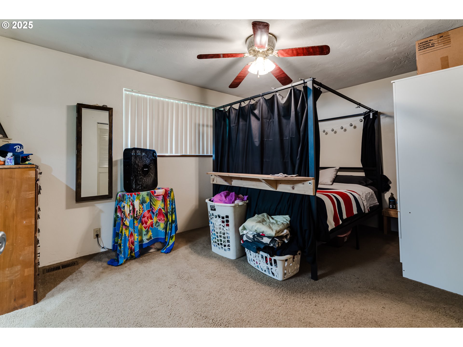 3911 Pam Street Eugene, OR 97402 - Photo 14 of 25 a bedroom with furniture and a flat screen tv