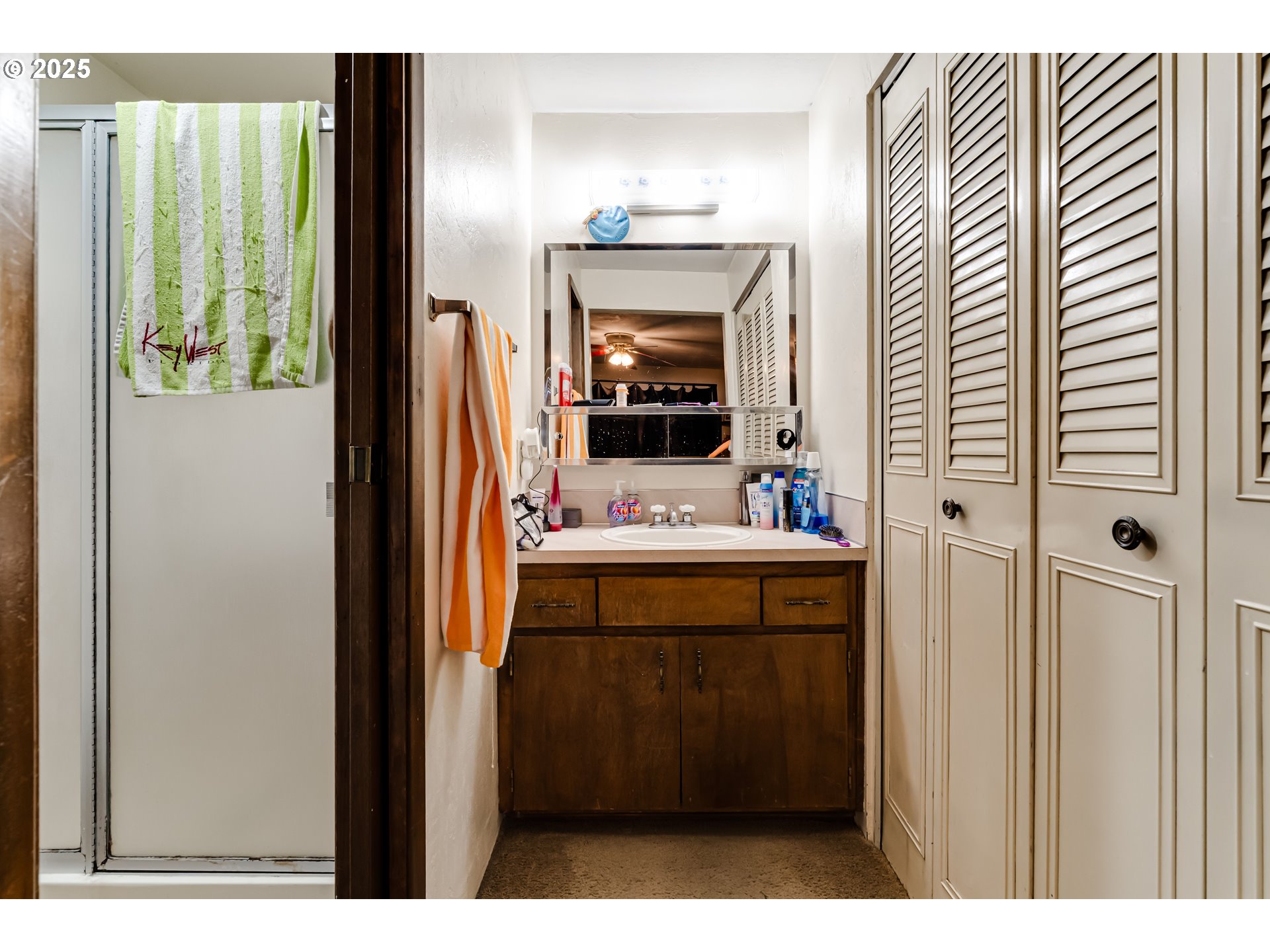 3911 Pam Street Eugene, OR 97402 - Photo 16 of 25 a bathroom with a sink and a mirror