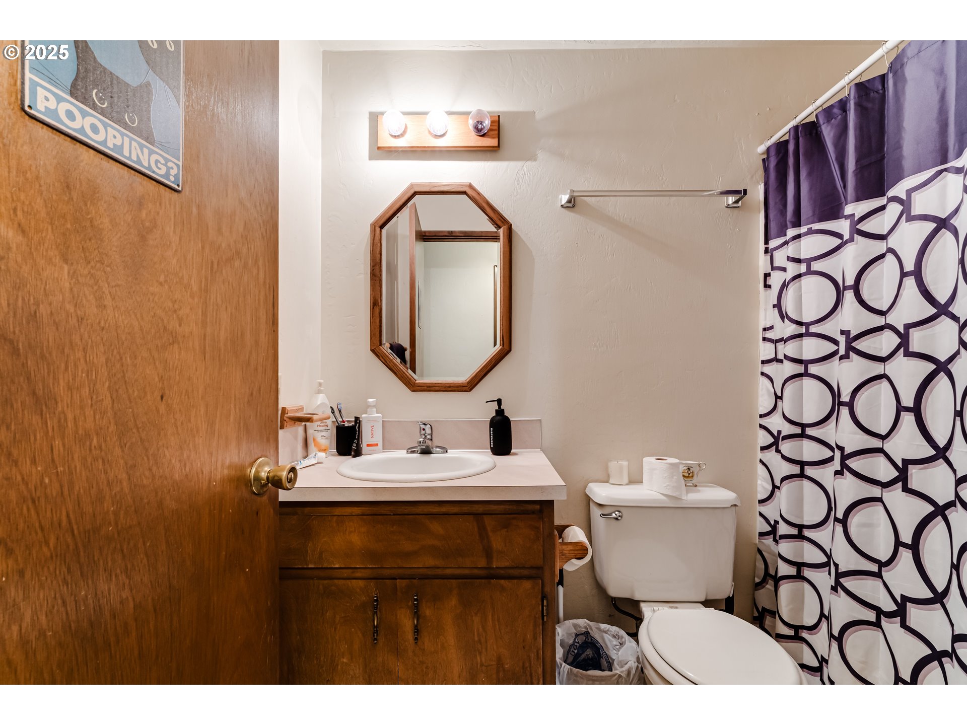 3911 Pam Street Eugene, OR 97402 - Photo 18 of 25 a bathroom with a sink vanity mirror and toilet