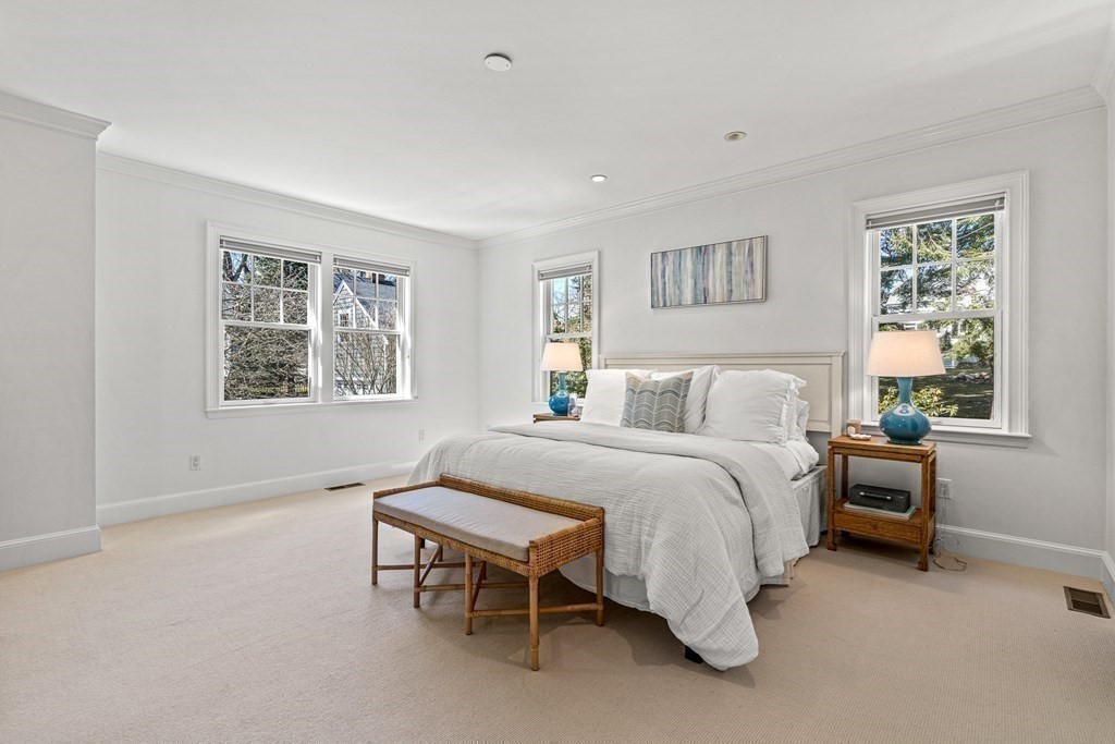 47 Cypress Road Wellesley, MA 02481 - Photo 19 of 36 a spacious bedroom with a bed and a window