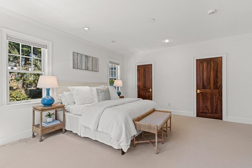 47 Cypress Road Wellesley, MA 02481 - Photo 20 of 36 a spacious bedroom with a bed and a window