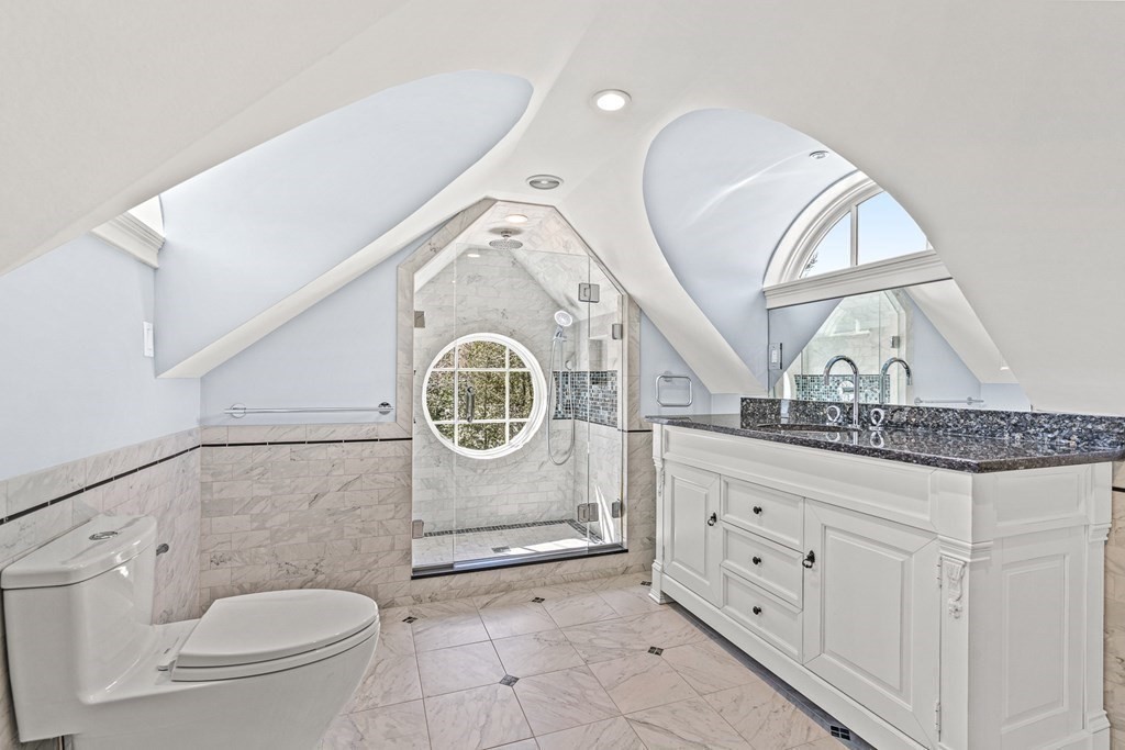 47 Cypress Road Wellesley, MA 02481 - Photo 25 of 36 a bathroom with a granite countertop toilet sink and mirror