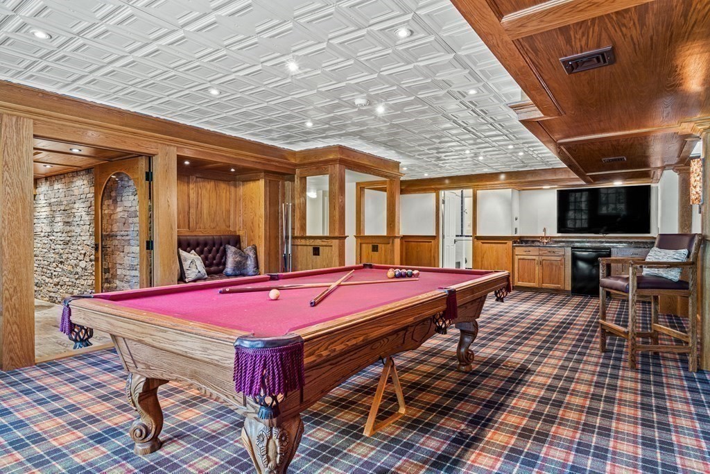 47 Cypress Road Wellesley, MA 02481 - Photo 27 of 36 a patio with a table and chairs