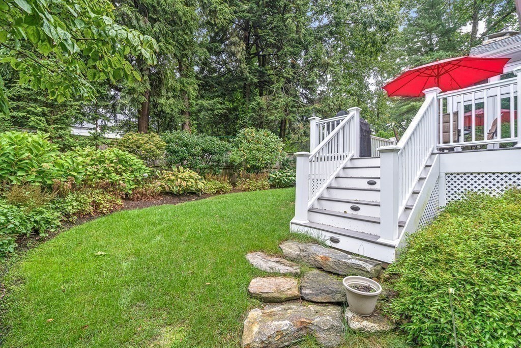 47 Cypress Road Wellesley, MA 02481 - Photo 32 of 36 a view of a house with backyard sitting area and garden